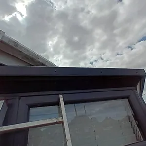 A view of the sky from the outside of a house.
