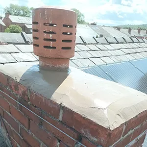 a brick chimney on top of a roof