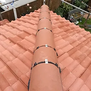 a large pipe on top of a roof
